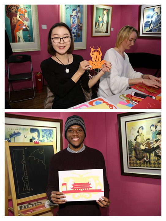 Foreign students experience Shanghai-style paper-cutting in Tianzifang